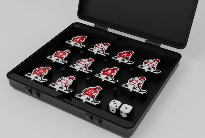 Open storage box with each player piece and both dice in its own slot